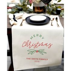 a christmas table runner with the words merry christmas on it