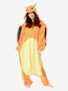 a woman in an orange pokemon onesuit is posing for the camera with her hands on her hips