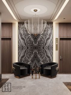 a room with two chairs and a chandelier hanging from the ceiling in front of a marble wall