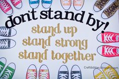 a sign that says, don't stand by stand up and strong together with colorful shoes