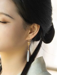 This set of earrings are part of the "Xujinhuan" collection, featuring a new Chinese style with natural gemstones in a long teardrop shape. The earrings are made of Gold-Plated 925 Sterling Silver and are designed to complement traditional Chinese clothing such as Hanfu and Qipao. The earrings will enhance your overall appearance and add a level of sophistication and elegance. Earrings are all designed by Xiyin studio and handmade.They offer a unique and elegant beauty. If you encounter problems during the purchase process,pls contact us in time. If you have any questions after receiving the goods,please contact us to resolve. Traditional Chinese Clothing, Elegant Beauty, Jade Earrings, New Chinese Style, Chinese Clothing, Wedding Jewelry Earrings, Natural Jade, New Chinese, Traditional Chinese