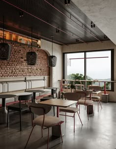 an empty restaurant with tables and chairs in front of large windows