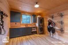 a wood paneled laundry room with lots of storage