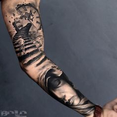 a man's arm with tattoos on it