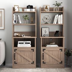 two wooden bookshelves with sliding doors on each side in front of a gray wall