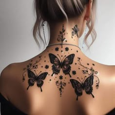 the back of a woman's neck is decorated with butterflies and flowers, which are all over her body