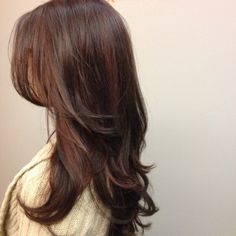 the back of a woman's head with long hair