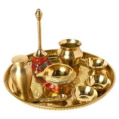 a brass tray with various items on it