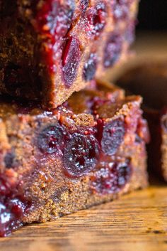 slices of berry cake on a wooden cutting board