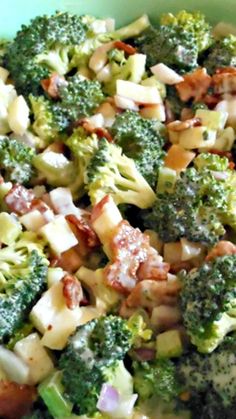 broccoli and other vegetables are mixed together in a bowl