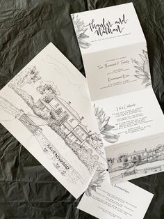 three wedding cards with drawings on them sitting on a sheet of wax paper next to each other