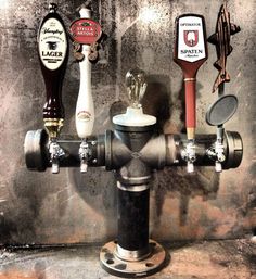 a fire hydrant with several different types of beer on it's spigot