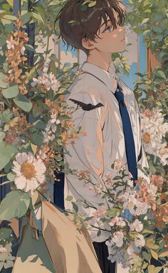 a man standing in front of some flowers