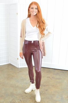 L. Mae's Spanx Faux Patent Ruby Leather Leggings are our go-to staple bottoms this fall and winter season! Featuring a snug glossy faux leather material and shaping waistband, these burgundy leggings are extra comfortable and can turn your outfit up a notch! Pair them with your favorite top and some booties for an on-trend look. Features: Model wearing size M If in between sizes, size up! Shiny faux leather material Skinny fit leggings Holiday/Christmas party Leather Leggings Outfits, Faux Patent Leather Leggings, Lederhosen Outfit, Women Leggings Outfits, Patent Leather Leggings, Leather Leggings Outfit, Leggings Outfits, Black Leather Leggings, Burgundy Leggings