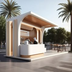 an outdoor cafe with palm trees in the background