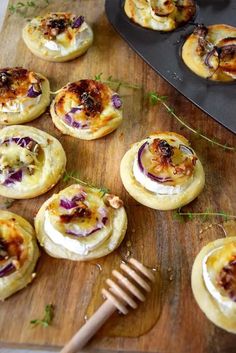 small appetizers are arranged on a cutting board