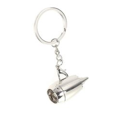 a keychain with a metal object hanging from it's side on a white background