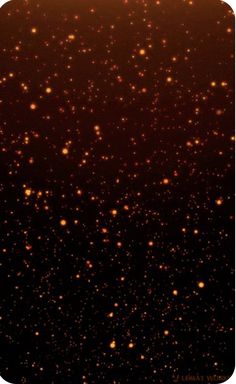 an orange and black background with small stars