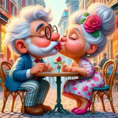 an old couple kissing each other at a table in the middle of a city street