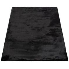 a black area rug on a white background