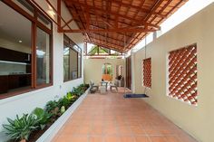 an outdoor area with tiled flooring and walls