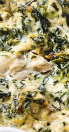 spinach and chicken casserole in a white dish