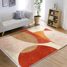 a living room with a couch and rug on the floor