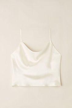 Silk satin crop camisole with soft cowl neckline that folds in front. Ideal to wear with high rise skirts or pants.
The model is 5’ 9” (175 cm) tall and is wearing a size S.

The silk in this piece is bluesign® certified. Elegant Tank Crop Top For Spring, Elegant Spring Tank Crop Top, Elegant Solid Color Cami Top, Elegant Tank Crop Top, Satin Cami Tops For Loungewear, Elegant Cropped Camisole With Built-in Bra, Sleeveless Satin Top For Loungewear, Satin Sleeveless Top For Loungewear, Elegant Cropped Top With Built-in Bra