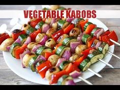 skewered vegetables on a white plate with toothpicks