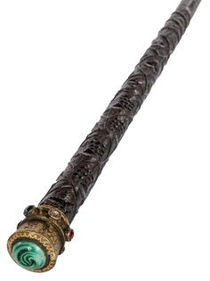 A RARE IRISH CARVED BOG OAK WALKING CANE 1890, with scrolling vines, shamrocks and serpent in relief, the jeweled finial on gilt metal, set with semi precious stones and central tiger eye, etched with scrolling shamrocks, 37'' (94cm)h. Fantasy Cane, Irish Walking Stick, Cool Canes, Hantverk Diy, Walking Tall