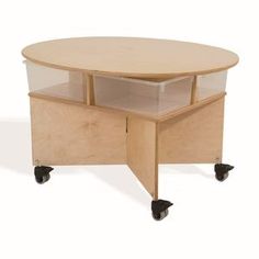 a round table with wheels and a storage compartment