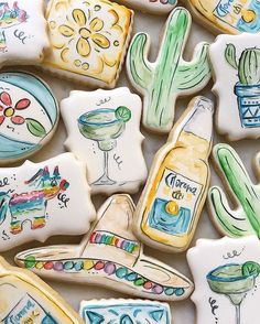 some decorated cookies are sitting on a table