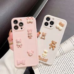 two phone cases with teddy bears on them, one is pink and the other is white