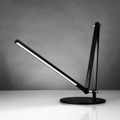 a black and white photo of a desk lamp