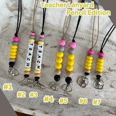 TEACHERS! Need a new lanyard for the upcoming school year? Get yourself one of these really cute pencil lanyards! ✏️ Made with silicone beads that are easy to wipe off and a breakaway clasp just in case it gets stuck.  Plastic ID holder included :) Silicone Lanyard Diy, Silicone Beaded Lanyards, Silicone Bead Lanyard Ideas, Diy Teacher Lanyard Beads, Diy Teacher Lanyard, Diy Lanyards, Teacher Lanyard Beaded, Silicone Bead Lanyard, Sweet Stand