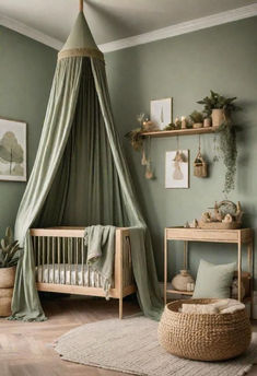 a baby's room with green walls and furniture