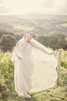 a woman in a white dress and veil