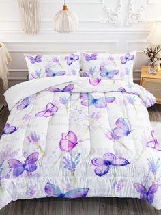 a white bed with purple butterflies on it