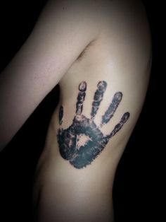 a person's arm with a hand print on it