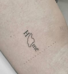 a person with a tattoo on their leg that says h m e f n d