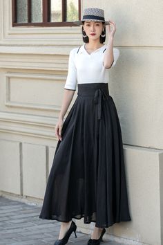 Elegant Flow: Stylish High-Waist Black Maxi Skirt 4900 – XiaoLizi Elegant Black Skirt With Tie Waist, Elegant Spring Pleated Skirt With Belt, High Waist Flowy Skirt With Wide Waistband, Elegant Skirt With Belt, Elegant Relaxed Skirt With Belt, Elegant High Waist Skirt With Belt, Flowy Flared Maxi Skirt With Wide Waistband, Belted Flared Pleated Skirt, High Waist Belted Skirt For Spring