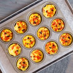 muffin tins filled with different types of food