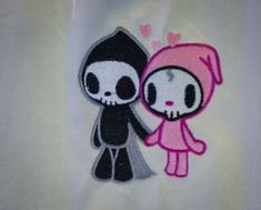 two cartoon characters holding hands on a white shirt