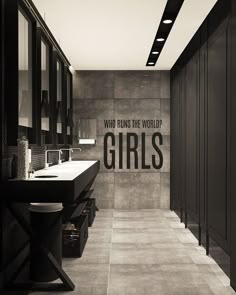 a bathroom with two sinks and mirrors on the wall that says, who runs the world? girls