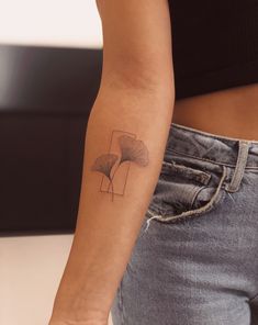 a woman with a small tattoo on her arm