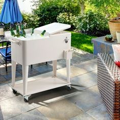 a white cooler sitting on top of a patio