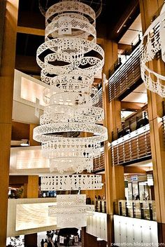 a large chandelier hanging from the ceiling in a building