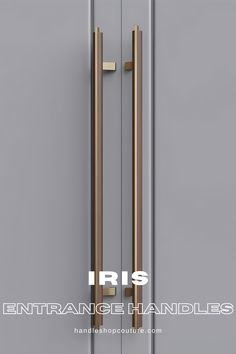 an open door with the words iris entrance handles in white and gold lettering on it