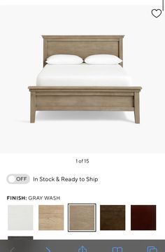 the bed frame is made with wood and has white sheets, pillows, and throw pillows