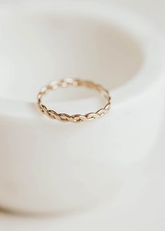 An ode to our idol, Willie Nelson: meet Nellie! This flat, woven style reminded us of Willie's iconic braids so we named this ring after the legend himself! Band measures 2.4mm wide. Available in 14kt Gold Fill + Sterling Silver. Claire pairs it with the Starburst Ring, Beaded Ring and Midi Wrap Ring. Dani pairs it with our Sterling Silver Cigar Band, Dani Chain Ring, and two Sterling Silver Beaded Rings. Our jewelry is handmade so each piece will be unique and may vary slightly from what is pic Ring Flatlay, Confetti Ring, Jewelry Knowledge, Everyday Wear Jewelry, Beaded Ring, Hammered Rings, Willie Nelson, Handmade Jewelry Designs, Rings Cool